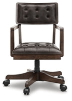 Dark brown tufted office chair with padded back and seat, swivel base