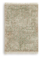 Rossbury rug with light beige base, green flecks and rust accents, fringed edge