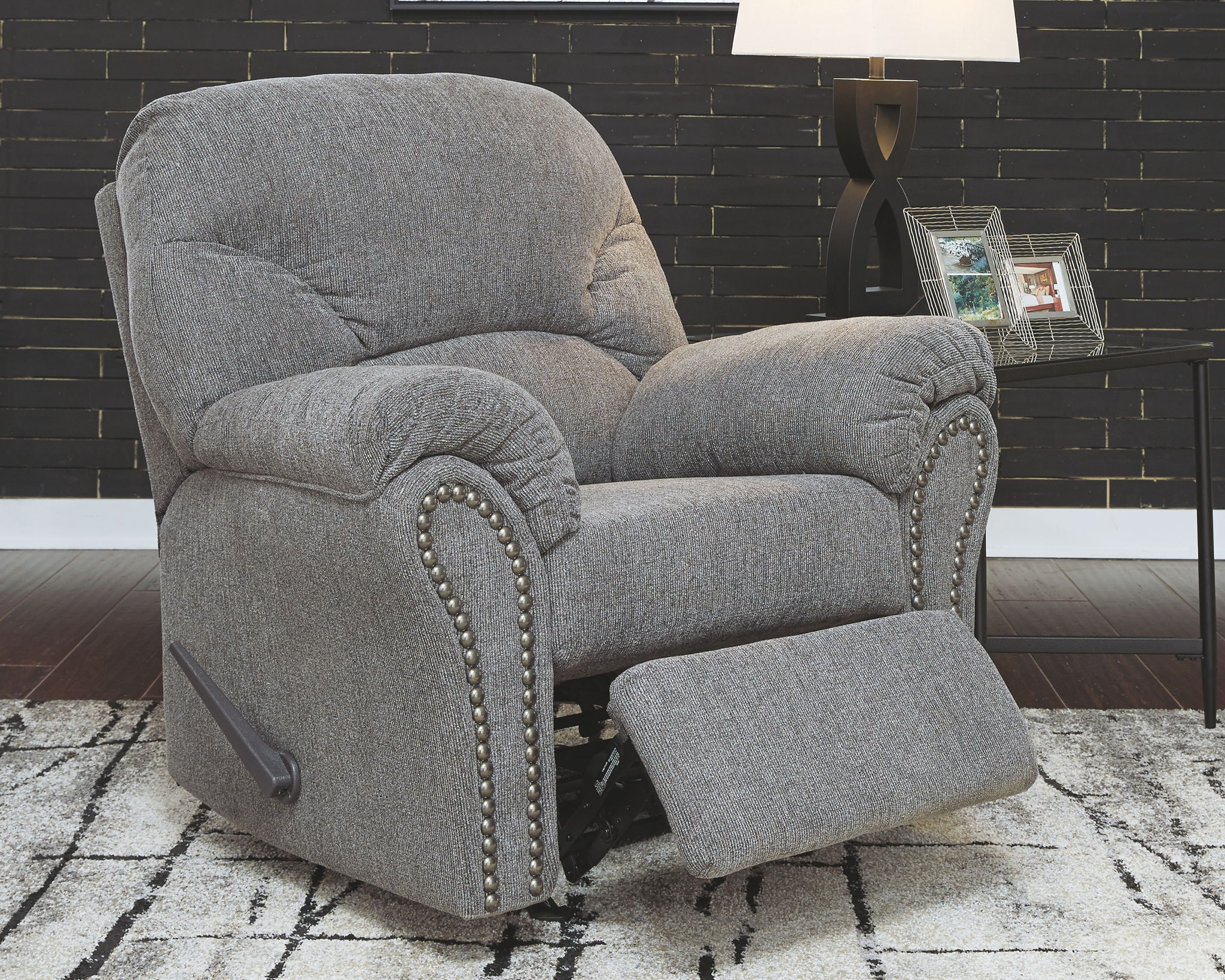 Pewter fabric rocker recliner with nailhead trim and extended footrest