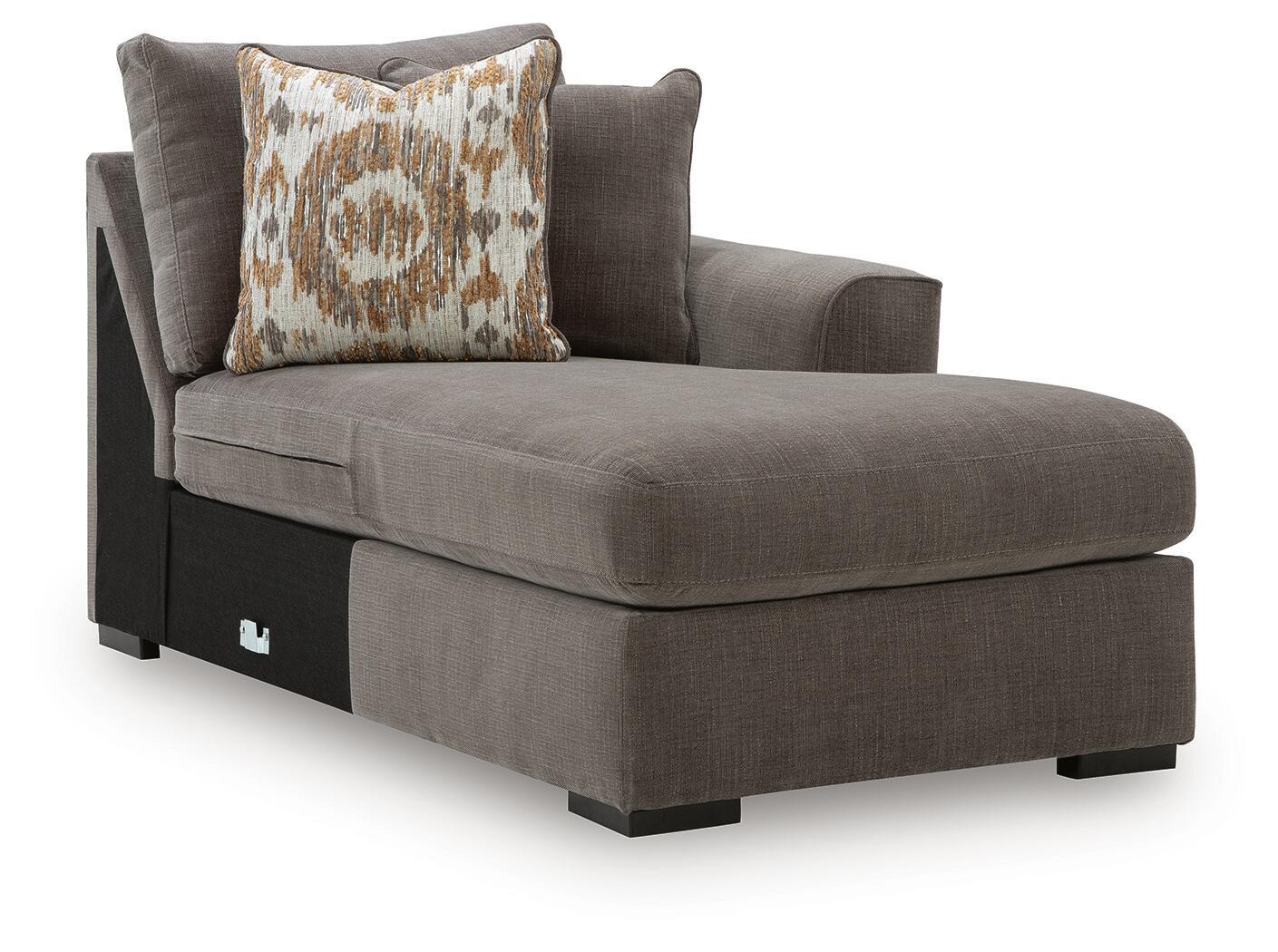 Gray right-arm facing corner chaise with patterned throw pillow and sturdy wooden legs