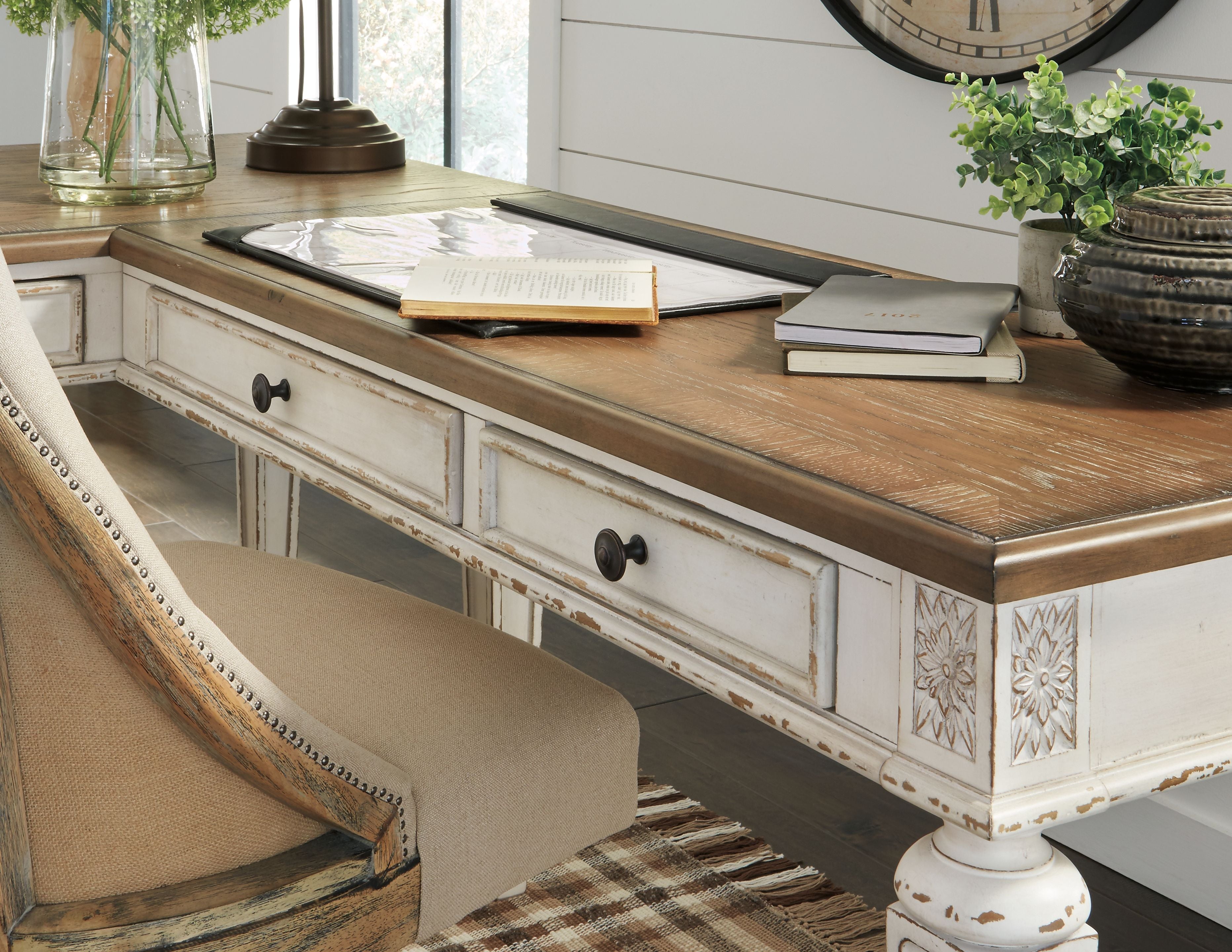 Home office desk return side view with brown wood top and two white drawers