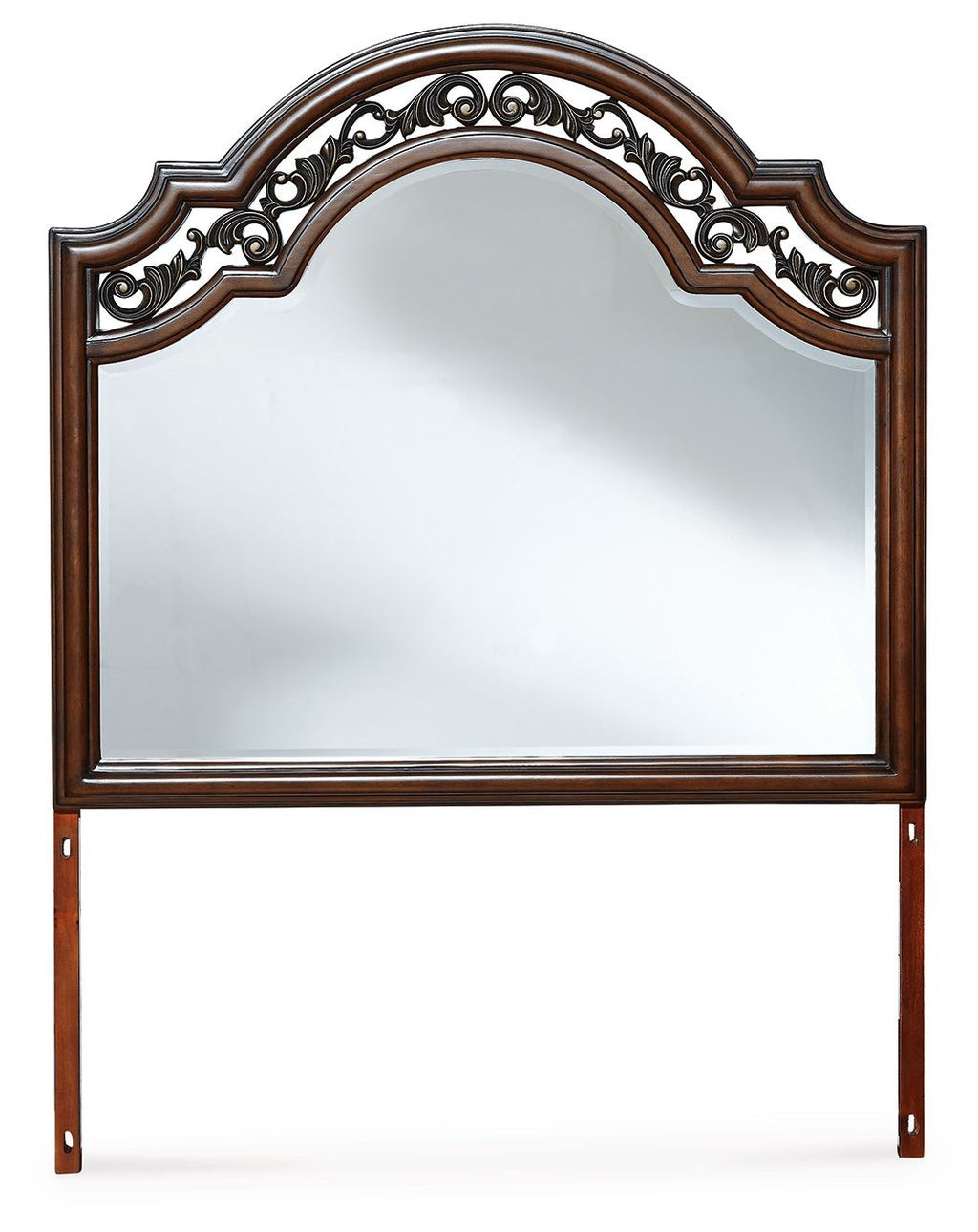 Brown arched bedroom mirror with ornate carved crest and wood legs