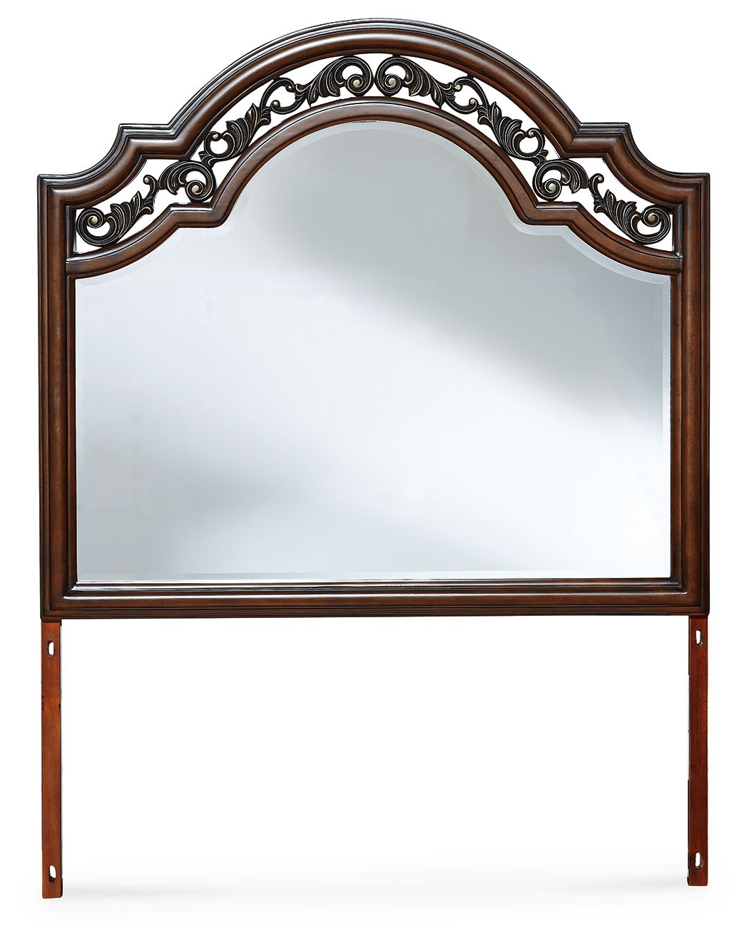 Brown arched bedroom mirror with ornate carved crest and wood legs