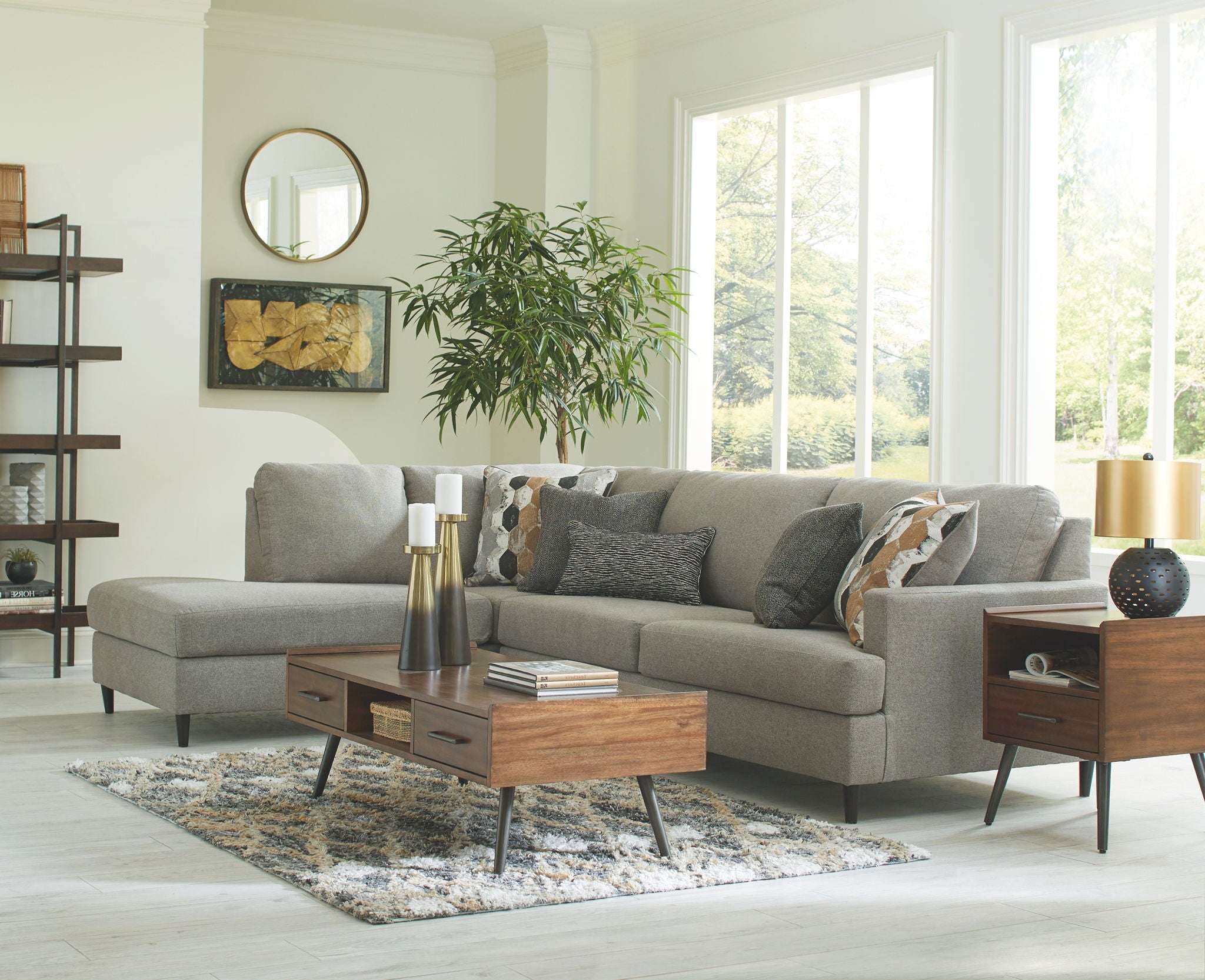 Granite gray sectional sofa with chaise, supportive seat cushions, and patterned accent pillows