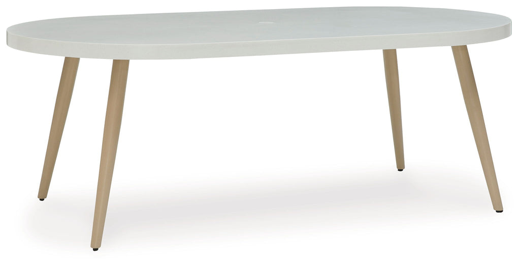 Dining table with light gray round top and light wood legs