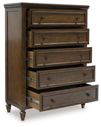 Brown five-drawer chest with metal knobs and visible drawer frames, turned legs