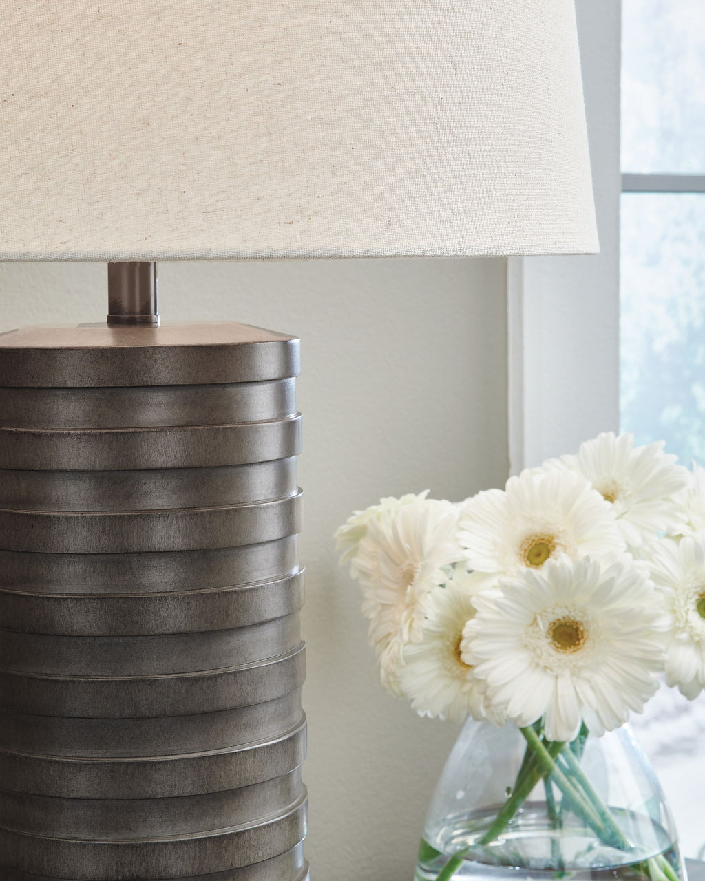 Set of 2 table lamps with dark ribbed poly bases and off-white fabric shades
