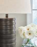 Set of 2 table lamps with dark ribbed poly bases and off-white fabric shades