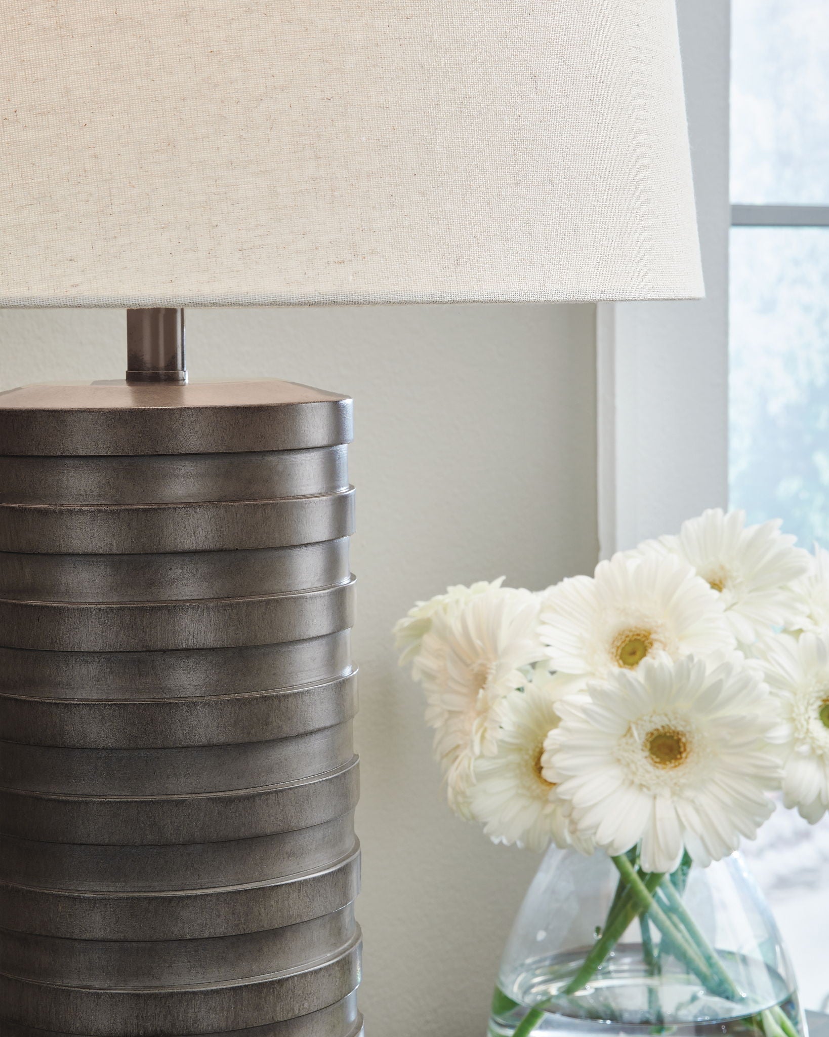Set of 2 table lamps with dark ribbed poly bases and off-white fabric shades
