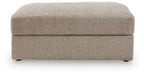 Oversized ottoman front view, rounded top, burlap-style beige upholstery and low legs