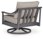 Gray swivel lounge chair with cushion, slatted back detail, round swivel base