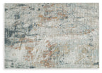 Distressed area rug, close-up of mottled light gray/blue with orange and teal flecks