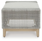 Gray woven ottoman with tufted-look backless cushion on light wood legs