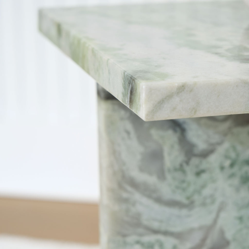 Marble-look tabletop edge and corner detail, green veined finish