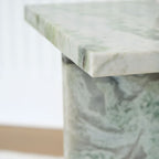 Marble-look tabletop edge and corner detail, green veined finish