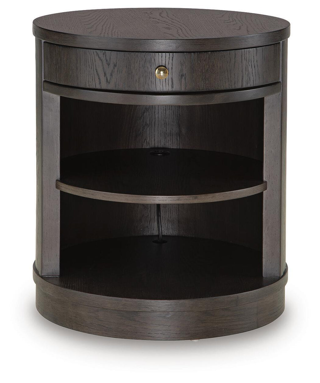 Dark brown accent table with round top, drawer, and curved open shelves