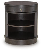 Dark brown accent table with round top, drawer, and curved open shelves