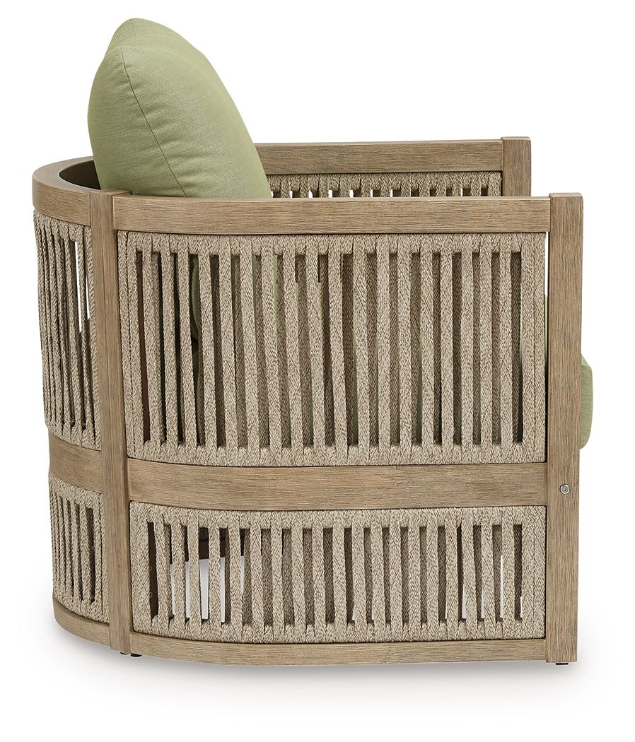 Outdoor lounge chair with light beige wooden arms and green back cushion