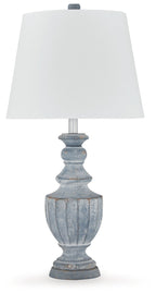 Antique blue table lamp with white fabric shade and ornate fluted base