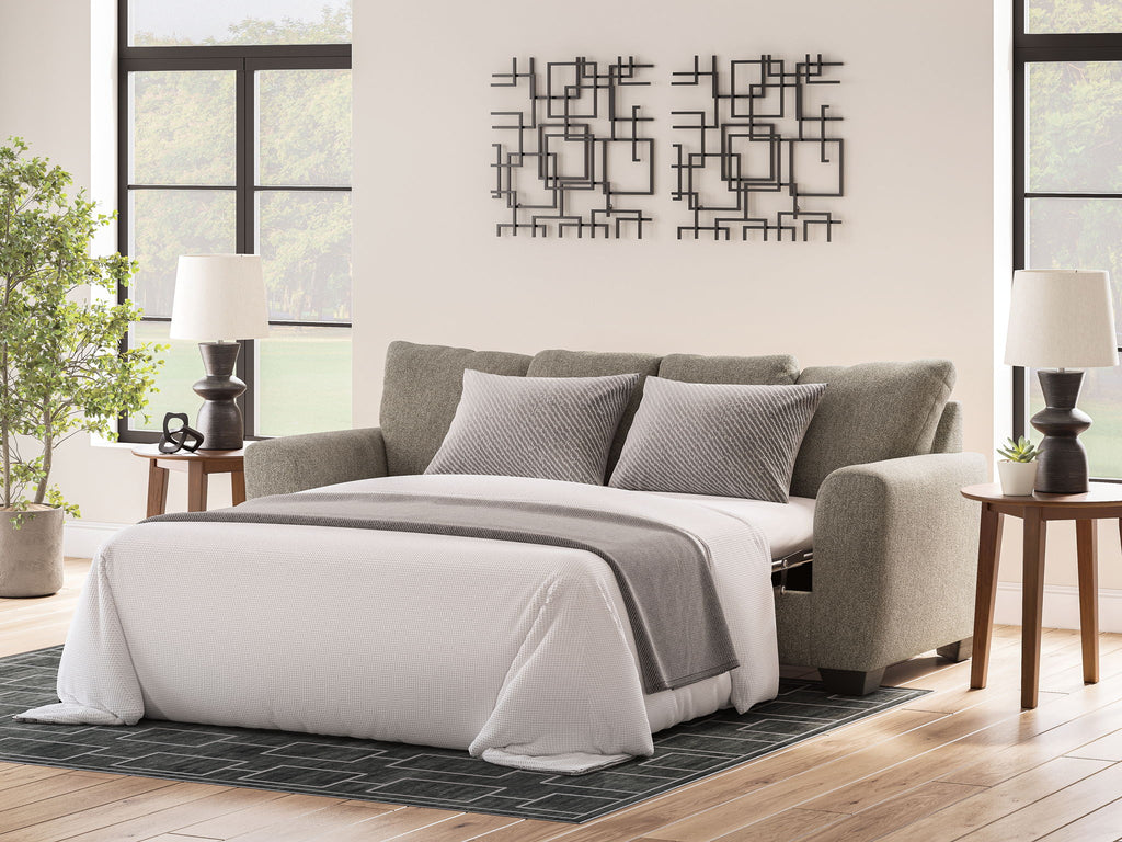 Gray queen sofa sleeper with open bed, gray throw, and four square pillows