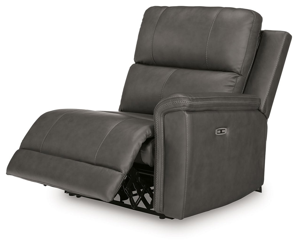 Power wall recliner chair in dark gray with extended footrest and upright headrest