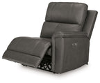 Power wall recliner chair in dark gray with extended footrest and upright headrest