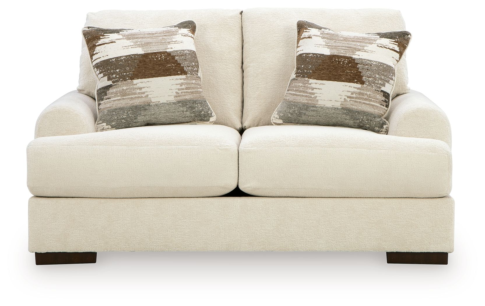 Cream loveseat sofa with two seat cushions and two patterned accent pillows, square arms