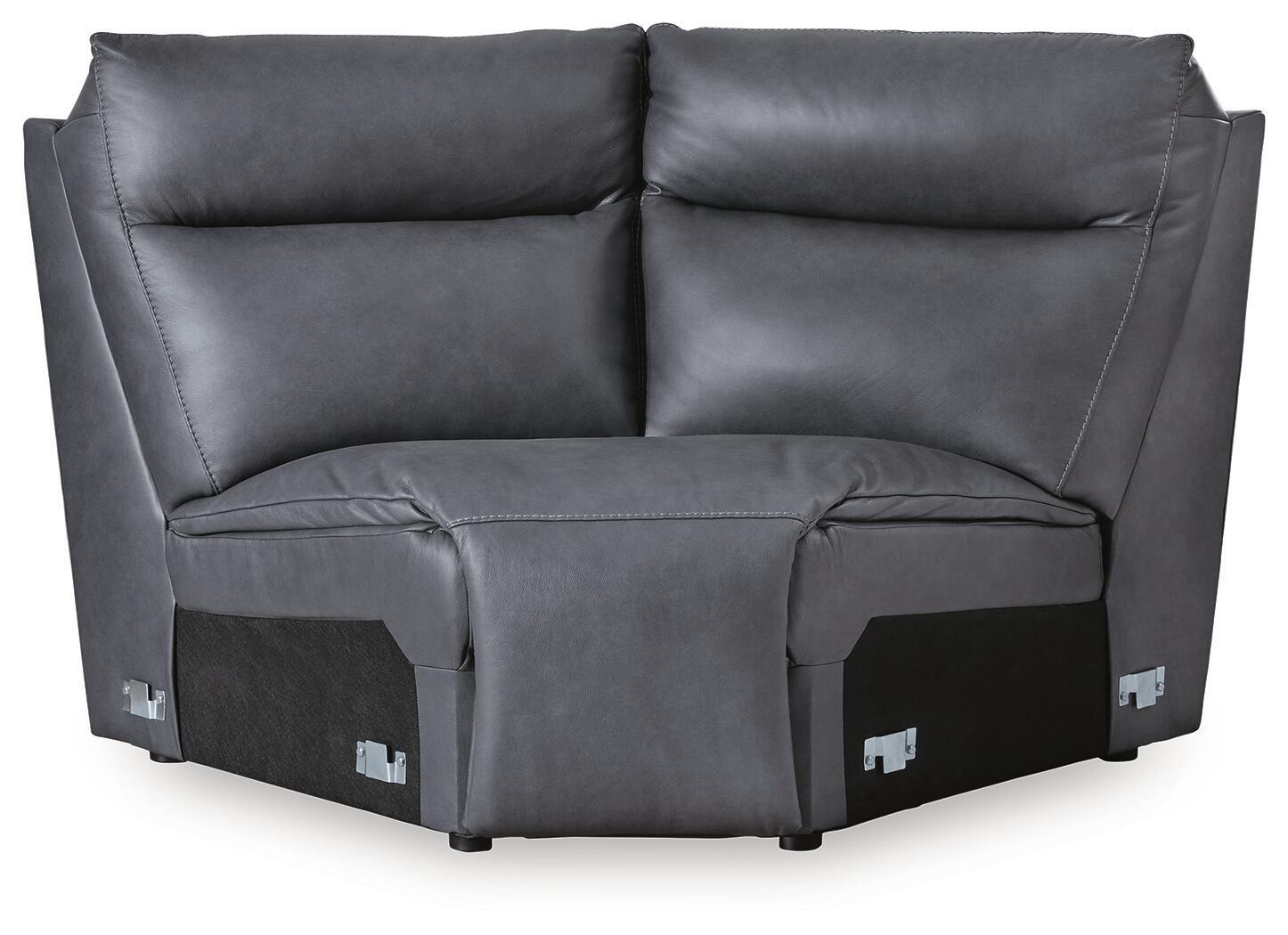 Dark gray sectional wedge with cushioned backrest, curved arms, and block base