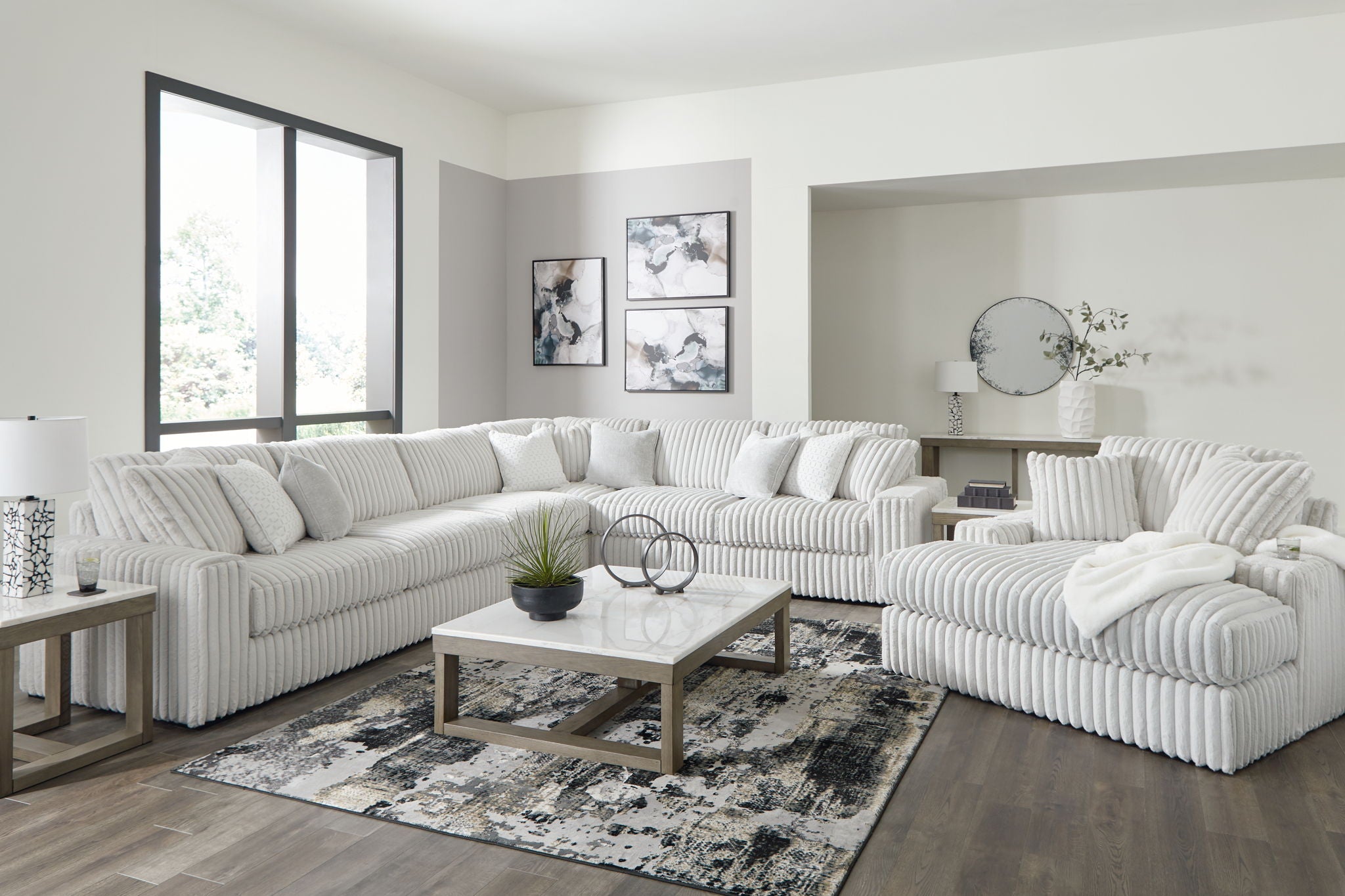 Gray sectional sofa set with chaise, deep seats and ribbed upholstery detail