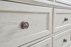 Antique white dresser drawer with round metal knob and wood grain texture