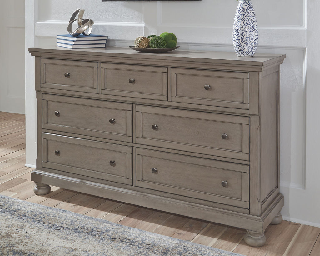 Light gray Lettner dresser with long drawer fronts and round metal knobs