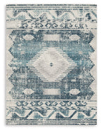 Blue and ivory area rug with distressed geometric medallion pattern