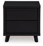 Black two-drawer night stand with two stacked drawer fronts and dark legs
