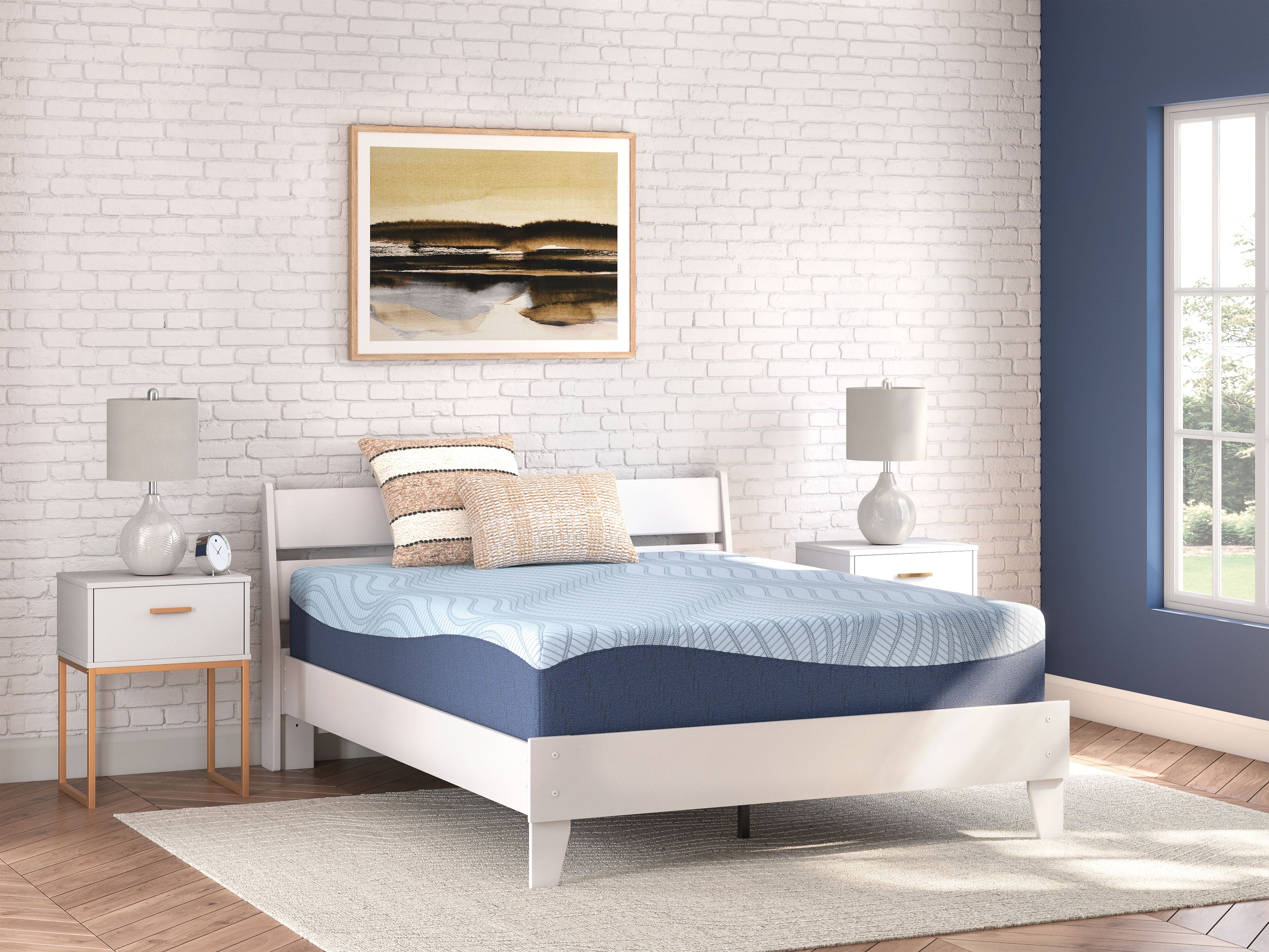 Blue memory foam mattress on white bed frame, wavy top pattern
