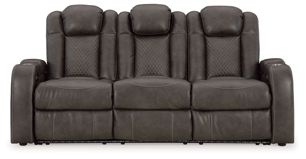 Power reclining sofa with adjustable headrests, dark gray upholstery, front view