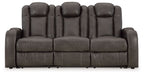 Power reclining sofa with adjustable headrests, dark gray upholstery, front view