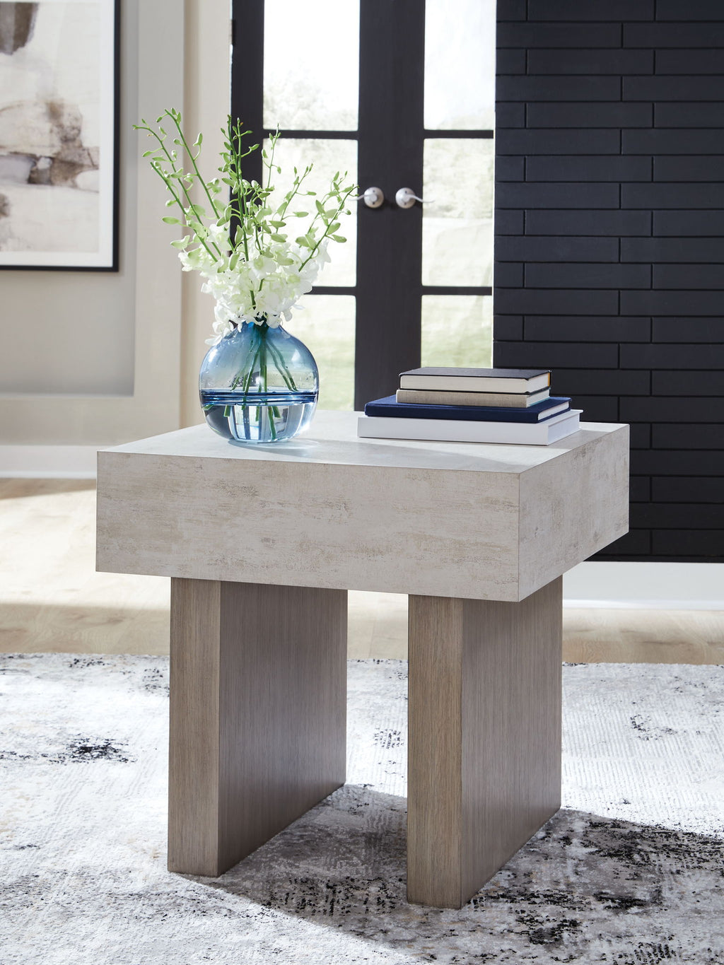 Jorlaina rectangular table with whitewashed top and light wood legs in a room setting