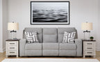 Pewter power reclining sofa with three seat sections, gray upholstery, and patterned throw pillows