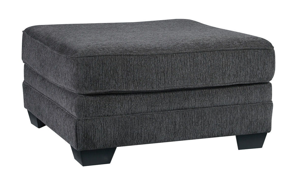 Dark gray ottoman with rectangular cushioned top and upholstered base