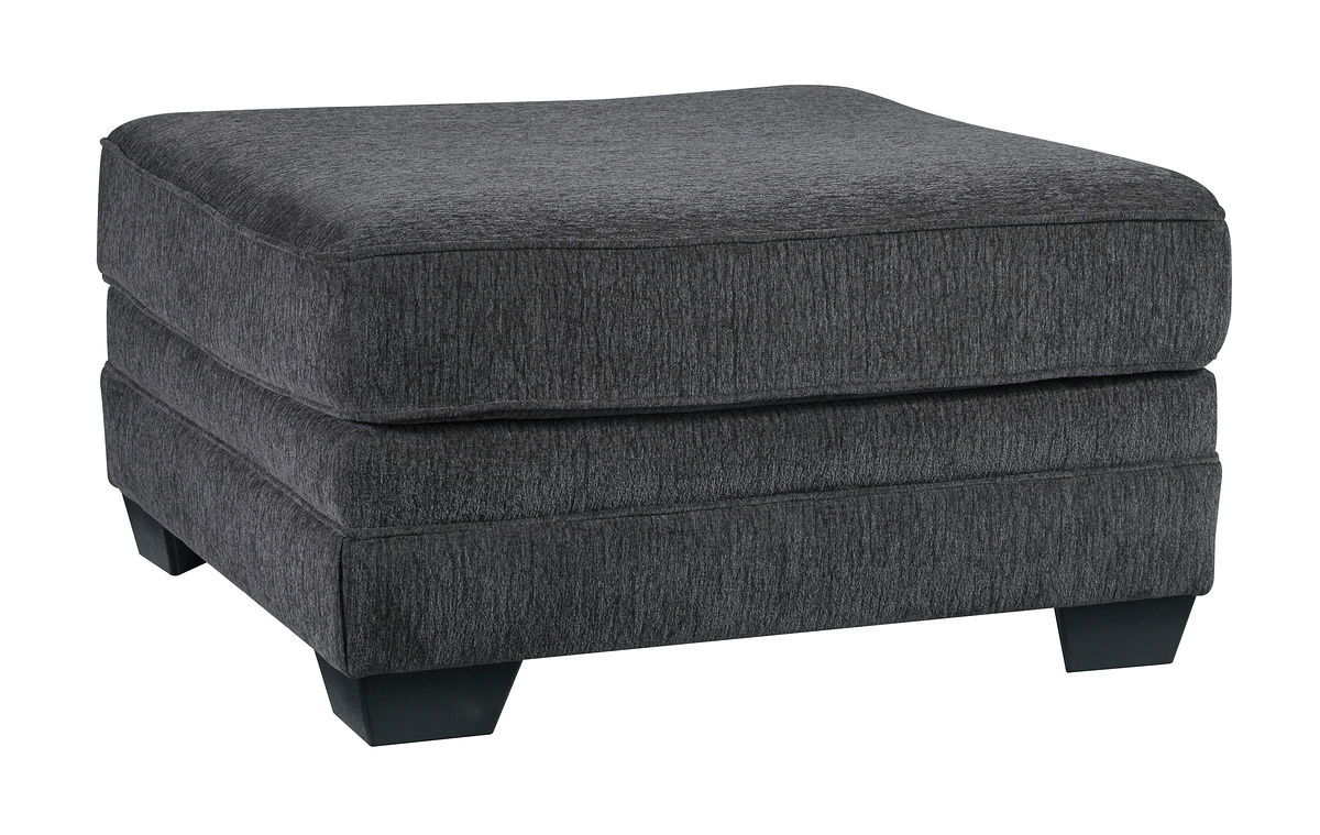 Dark gray ottoman with rectangular cushioned top and upholstered base