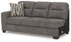 Graphite gray fabric sofa with chaise and striped accent pillow