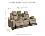 Sand power reclining sofa at an angle with extended footrests and reclined seats.