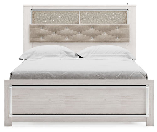 Queen bookcase bed with white slatted sides and padded light beige tufted headboard
