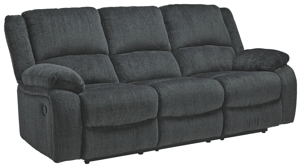Draycoll reclining sofa in slate with rounded armrest, cushioned chaise seat, tufted back