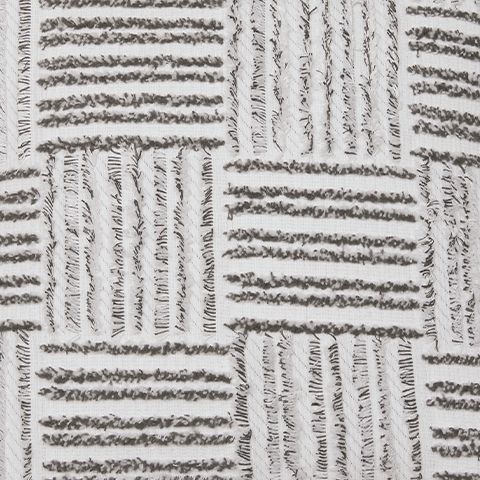 Off-white cushion fabric with dark stitched stripes and textured weave detail