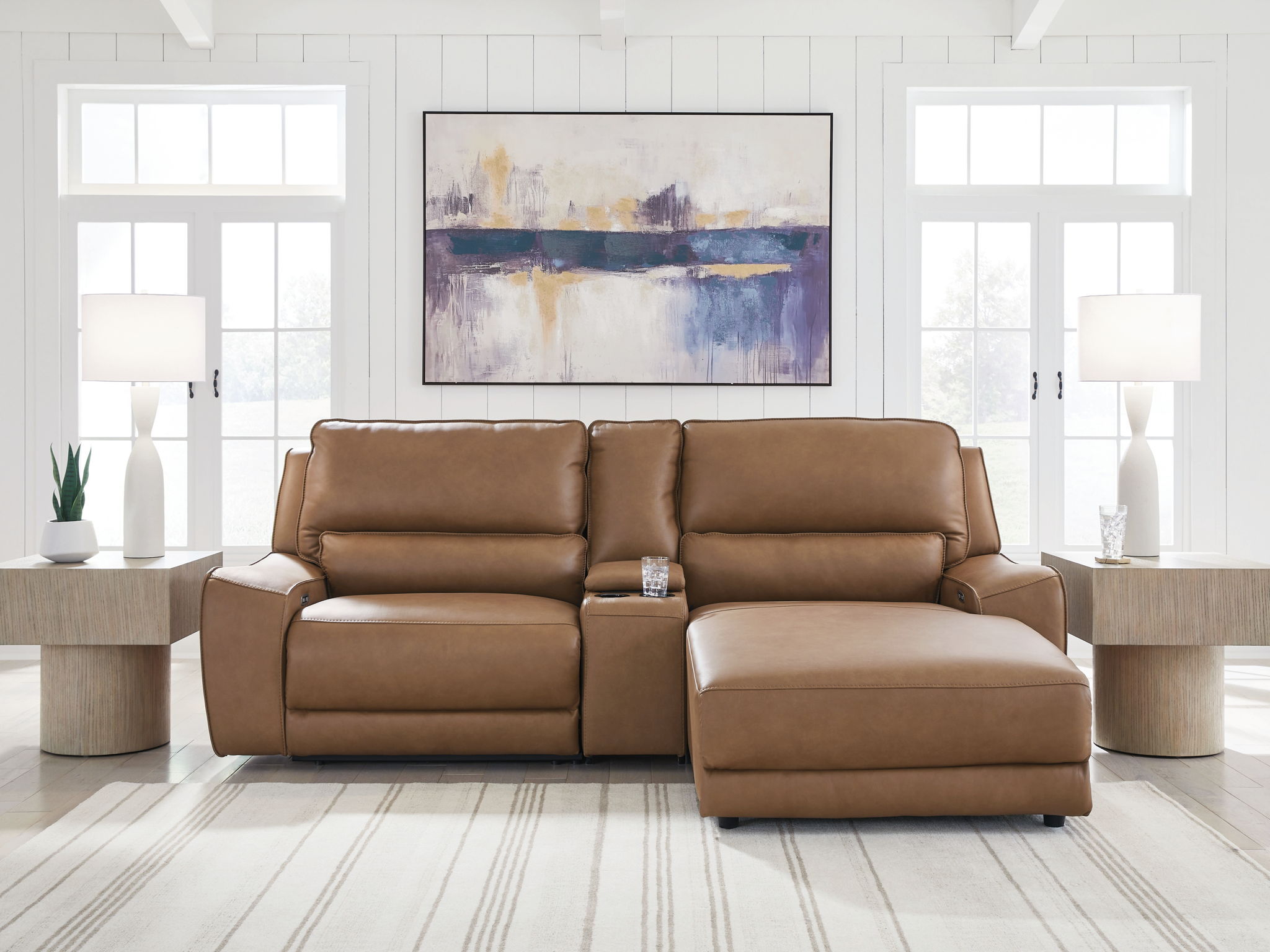 Caramel power reclining sectional sofa with chaise seat and recline ottoman cushion
