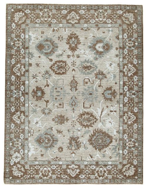 Memory foam rug with ornate border and light cream field, dark brown pattern