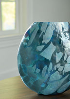 Blue glass vase with flared top and curved sides, abstract mottled finish