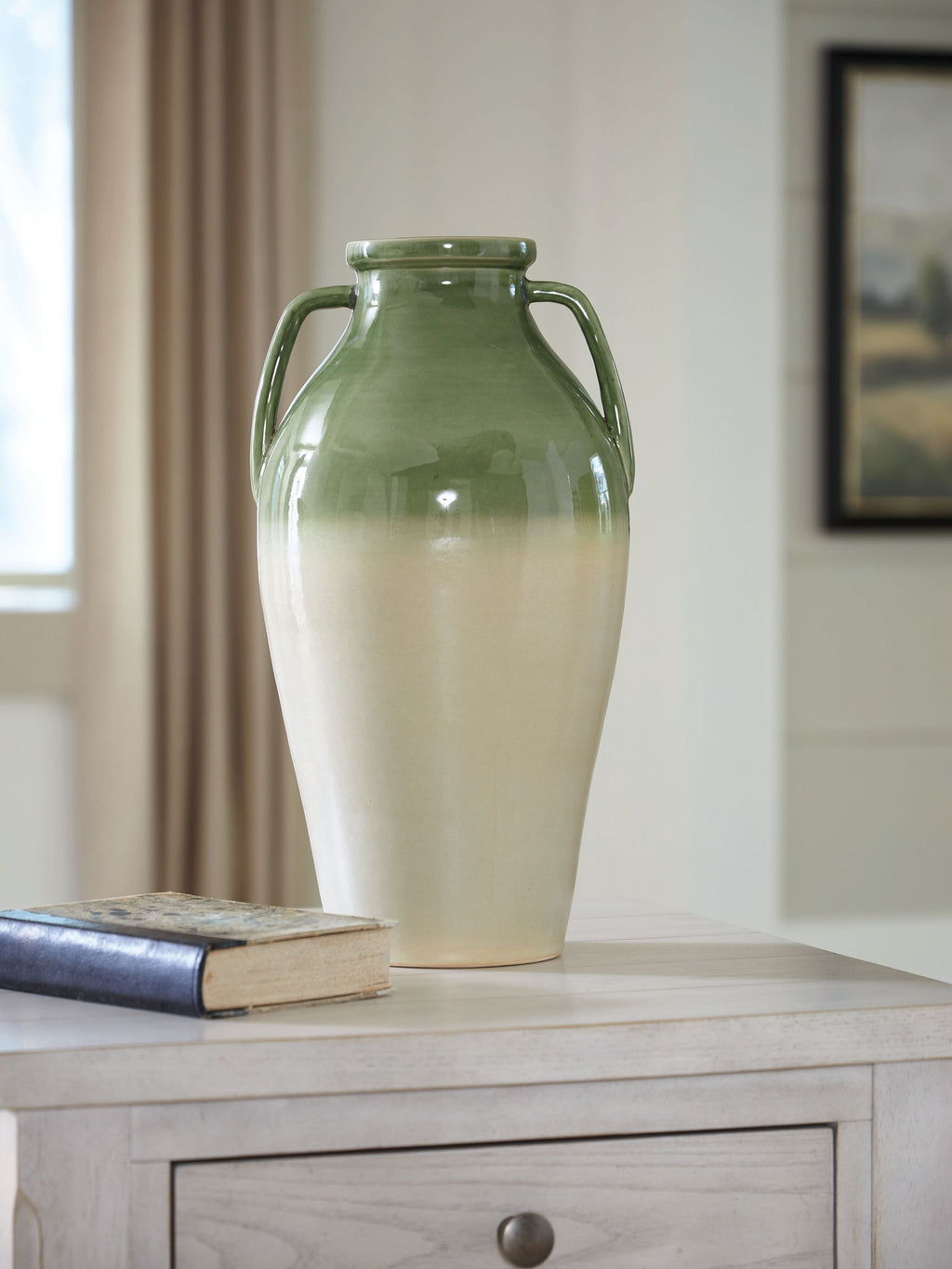 Green and beige glazed vase with two side handles and narrow neck