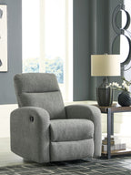 Gray fabric rocker recliner with padded headrest, armrests, and circular control